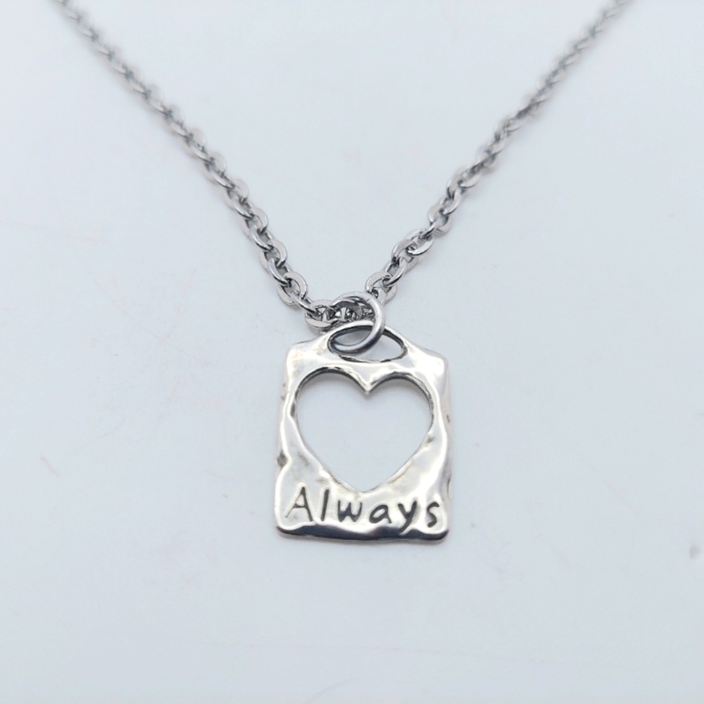 .925 Sterling 3/4 x 1/2 Inch Heart Charm on 18 Inch Stainless Chain Necklace.